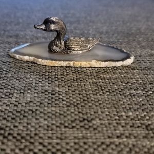 Pewter duck on an agate slice